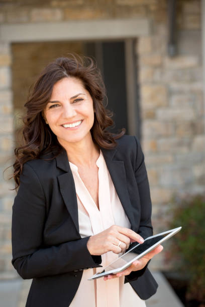istock Happy mature businesswoman at work. 1077041304