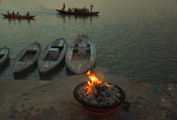 istock a burning fire pit put on ganges riverbanks at Varanasi, Uttar Pradesh in evening 1077044400