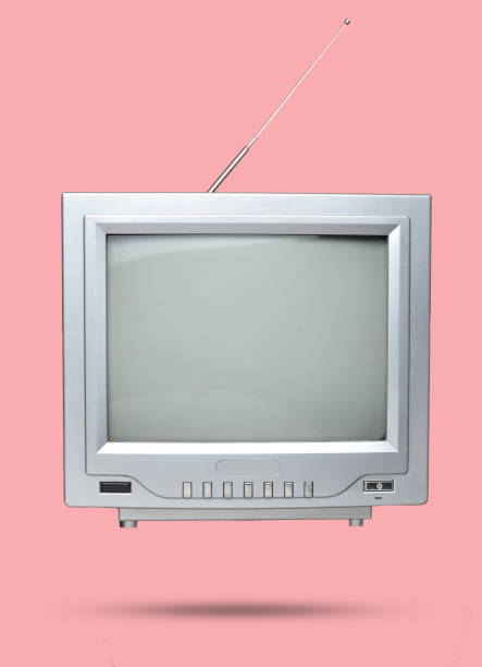 istock Retro tube TV and remote control on pink pastel background. 1077050724