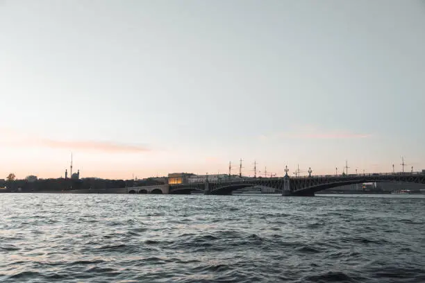 Photo of Elements of architecture of historical buildings.  Night view of the city at sunset. The streets of St. Petersburg with its bridges and rivers.