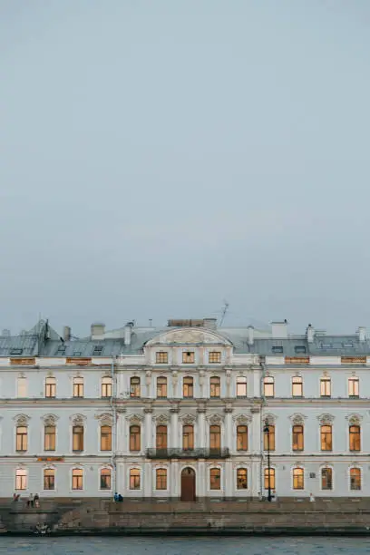 Photo of Elements of architecture of historical buildings.  Night view of the city at sunset. The streets of St. Petersburg with its bridges and rivers.