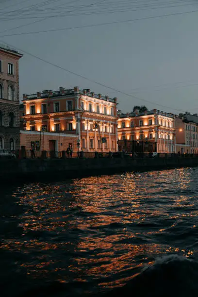 Photo of Elements of architecture of historical buildings.  Night view of the city at sunset. The streets of St. Petersburg with its bridges and rivers.