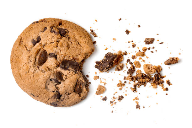 istock Chocolate chip cookie with crumbs  isolated on white background. Close up 1077053354