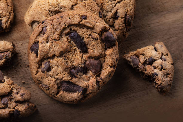istock Chocolate chip  cookies on wooden table. Top view 1077053388
