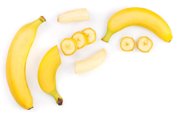 istock whole and sliced bananas isolated on white background with copy space for your text. Top view. Flat lay 1077058838