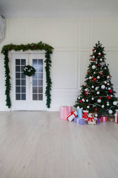 istock Christmas tree with presents new year holiday winter 1077059440
