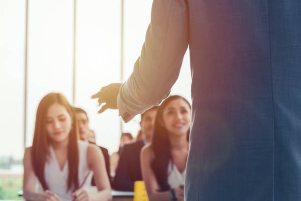 istock Asian Business men trainer giving presentation at conference 1077059636