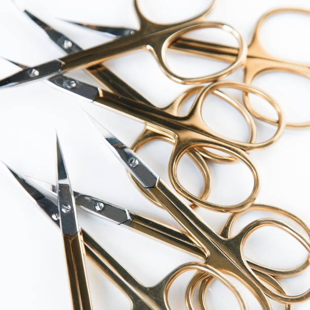 istock Makeup artist and eyebrow tools. Cut out the background and Flatley. Scissors, forceps and mask. 1077060810