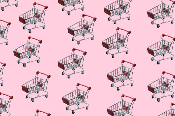 istock top view Many trolleys  on the pink floor. 1077061164