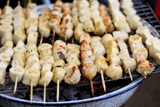 istock Grilled bananas are placed on the iron curry on charcoal stove. 1077061700