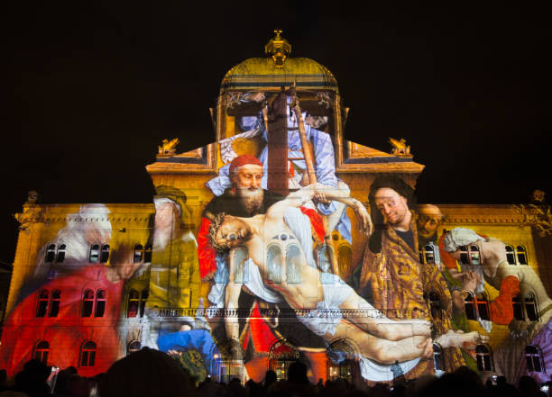 Yearly public Light Show "Rendesz-vous Bundesplatz" projected on the Swiss government building (Bundeshaus) Bern, Switzerland - November 11- 2017: Yearly public Light Show "Rendesz-vous Bundesplatz" projected on the Swiss government building (Bundeshaus) The light and sound show of 2017 is devoted to 500 Years of Reformation- bundeshaus stock pictures, royalty-free photos & images
