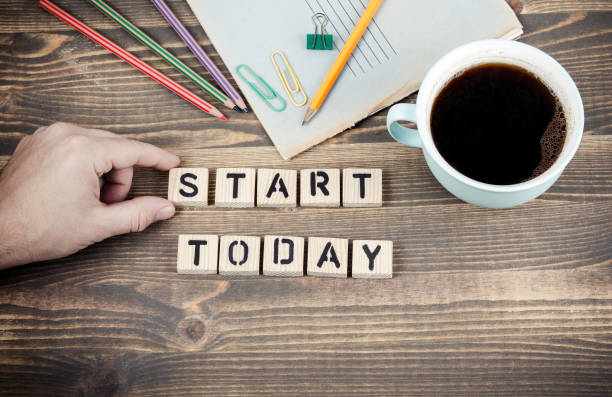 istock Start Today. Wooden letters on the office desk 1077062060