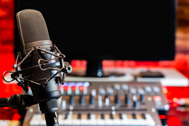 istock microphone on digital recording equipment in studio background 1077073126