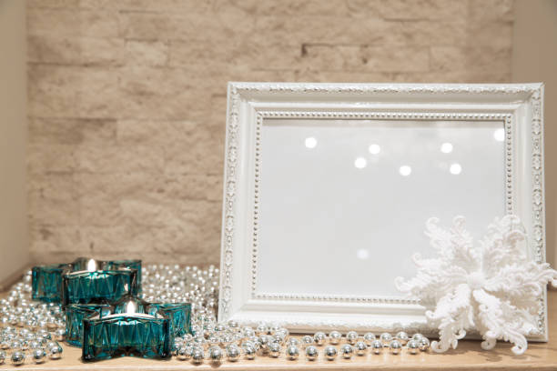 istock Christmas greeting card background, mock up. Turquoise star candlesticks, glittering silver beads and white glittering snowflake. 1077075688