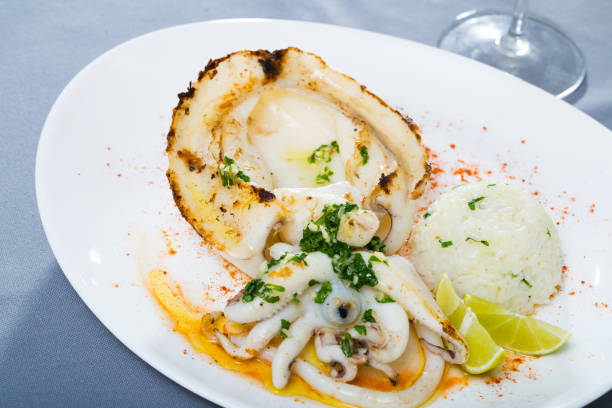istock Baked in oven cuttlefish, rice, lemon 1077077750