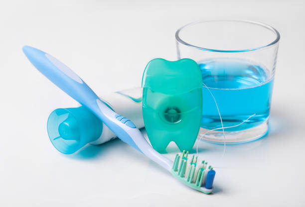 Tools for dental care: orthodontic brush, floss, toothpaste. Invisible dental aligners modern tooth brackets transparent braces to straighten teeth in cosmetic dentistry and orthodontics