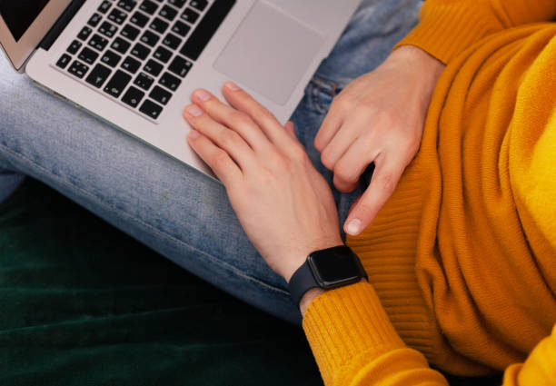 istock Men's hand touching smart watch on top view. Can be used as mock up 1077080408