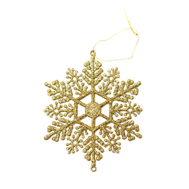 istock Close up christmas decoration golden snowflake isolated on white background 1077080680