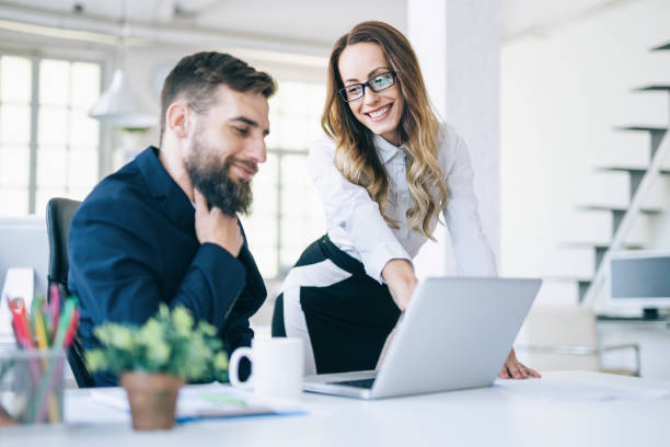istock Couple coworkers using laptop 1077080956