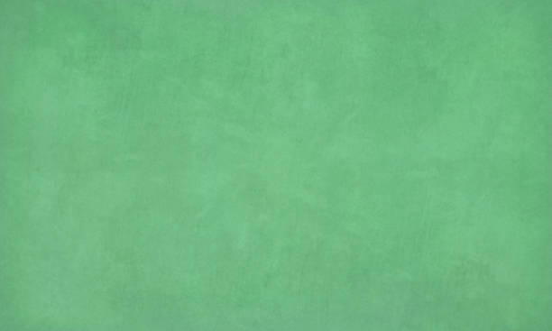 Emerald green colored scratched effect bright wall texture vector background- horizontal - Illustration of a Green chalk board, chalkboard Emerald green colored blotched paint effect bright wall texture vector background- horizontal - Illustration. Blank. No people. No text. Colour Gradient. copy space. Green board, classroom object. wallpaper, no text. faded, scuffed. blackboard texture stock illustrations