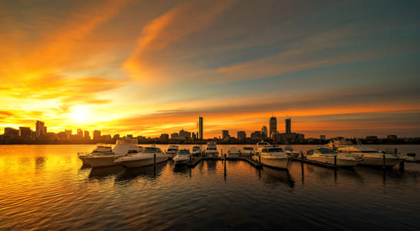 istock Sunrise over Boston city with boat and harbor 1077083898