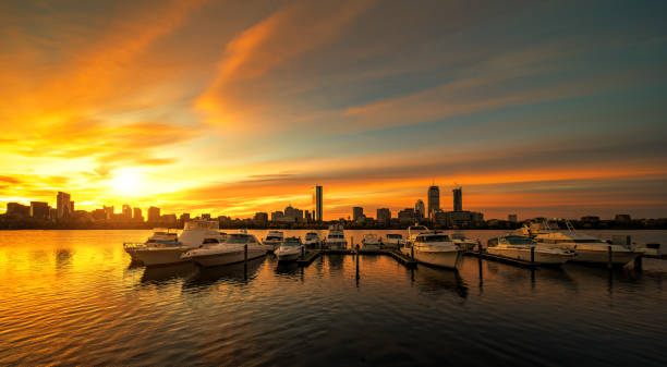 sunrise over boston city with boat and harbor - boston harbor imagens e fotografias de stock