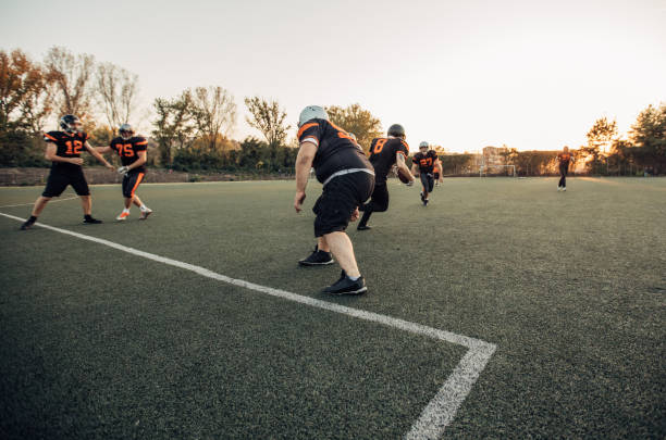 istock American football match in motion 1077086790