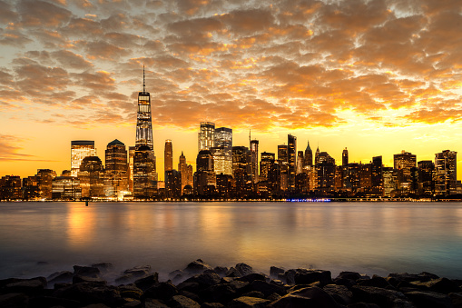 Cityscape of New york city with sunset and light from city and harbor, Manhattan, New york, USA, United states of America