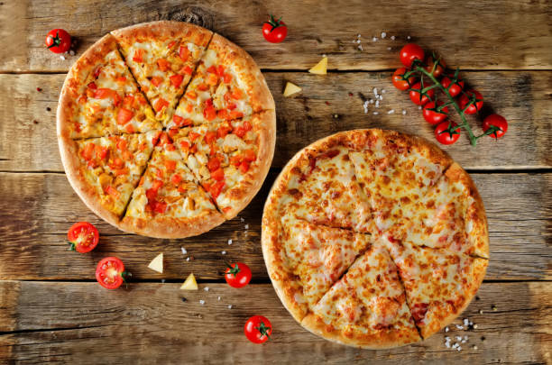 istock Pizza with cheese, tomato sauce and fresh tomatoes 1077090578
