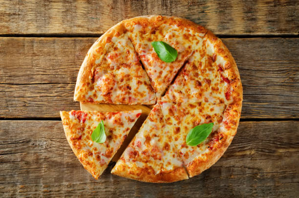 istock Pizza with cheese, tomato sauce and fresh tomatoes 1077090588