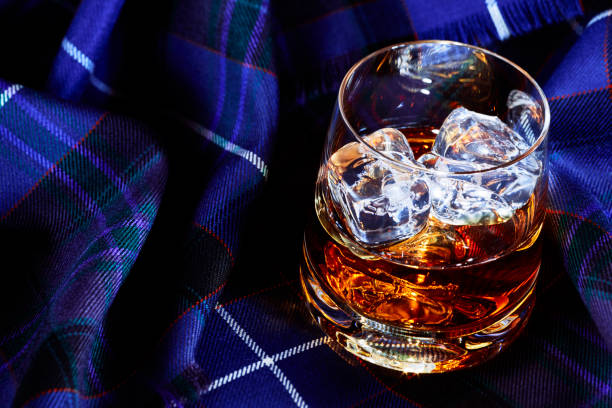 istock Whisky with ice, on tartan 1077090608