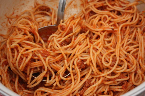 istock Spaghetti with Bolognese sauce in preparation 1077090700
