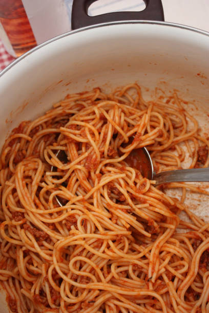 istock Spaghetti with Bolognese sauce in preparation 1077090762