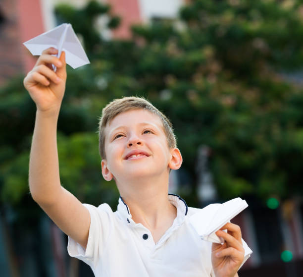 istock boy plaiing with toy airplane 1077091020