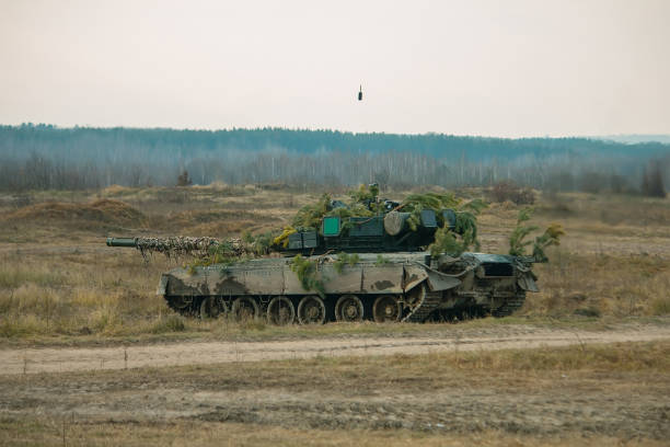 istock Throw a grenade in a military tank 1077091298