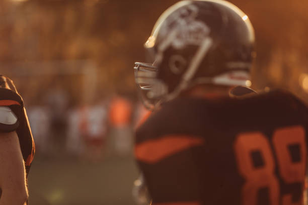 istock Football player with helmet 1077094184