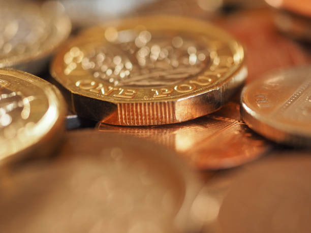 istock Pound coins, United Kingdom background 1077094278