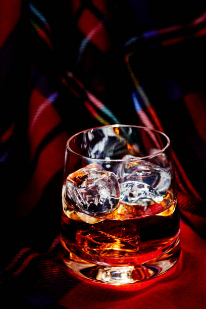 istock Whisky with ice, on tartan 1077095442