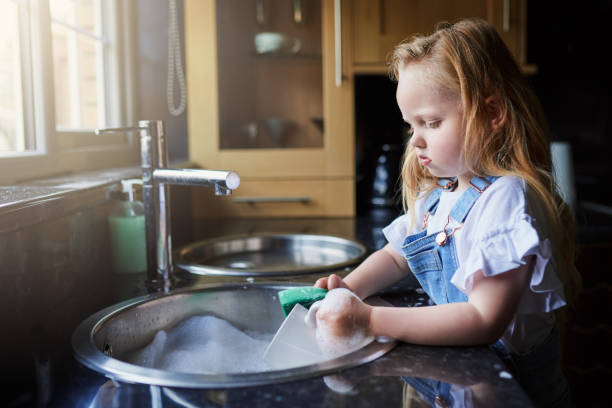 istock Can't believe I'm doing dishes again! 1077097624