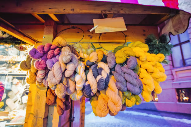 istock Yarn on stalls at Christmas market in Riga 1077099302