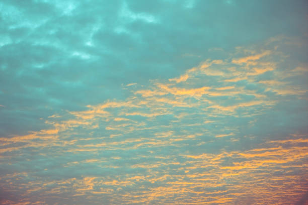blue and orange sky clouds at sunset or sunrise
