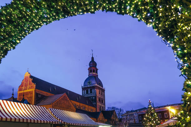 istock Christmas market at Dome Square with Xmas tree Riga evening 1077099412