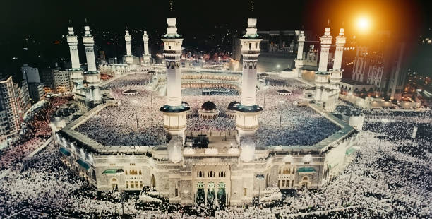 Praying in Mecca at Kaaba stock photo