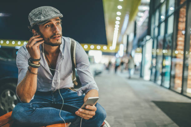 istock Handsome guy listening music 1077106272