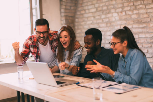 istock Good news young team in the office 1077107948