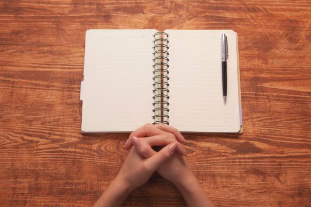 istock girl writes in a notebook 1077113550