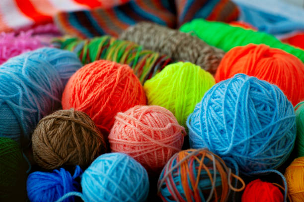 istock Many multicolored balls of yarn. 1077116704