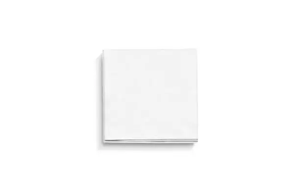 Photo of Blank white square folded napkin mock up, isolated