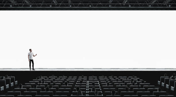 Presentation hall with person on scene auditorium blank screen mockup Presentation hall with person on scene auditorium watching on blank screen mockup. Empty display with speaker represent mock up. Public on training or forum template. stage stock pictures, royalty-free photos & images