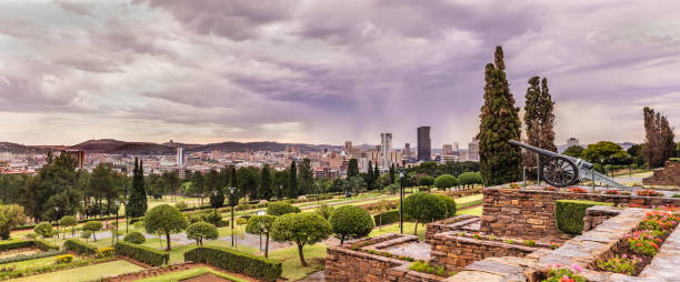 Pretoria cityscape under a stormy cloudscape Pretoria cityscape panorama under a moody sky with the Union Building gardens below.
Pretoria in South Africa is also known as "Jacaranda city" due to its trees planted in the city streets and parks. It is one of the capital cities, together with Cape Town and Bloemfontein. Pretoria is an academic city hosting three Universities. pretoria stock pictures, royalty-free photos & images